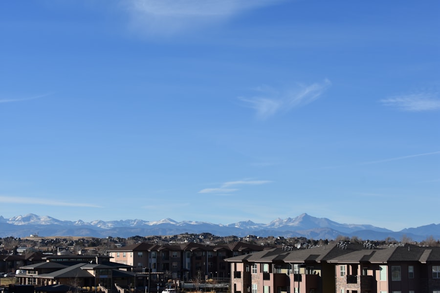 Denver skyline at dusk with mountains